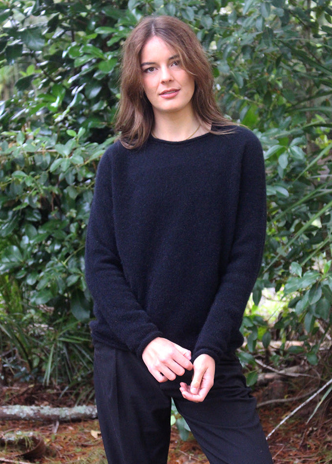 Black crew neck Merino Possum jersey. Classic light weight yet warm.