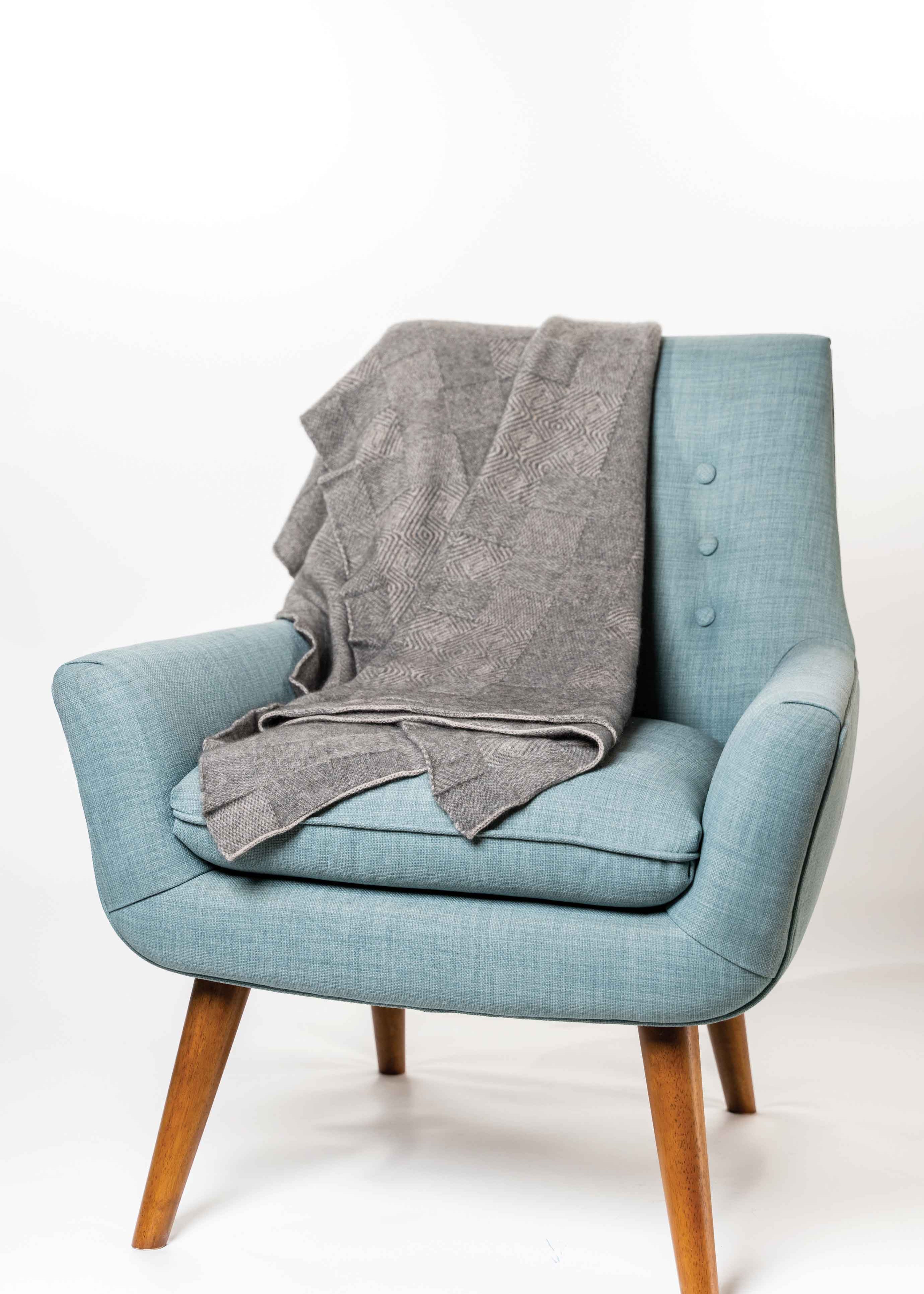 Koru Jacquard Throw
Possumsilk Collection™
A beautiful two-toned jacquard throw in a
multi-textured pattern.
This lovely, soft throw works well for both
home and travel.
YARN BLEND
65% Merino Wool
25% Possum Fur
10% Silk.
ONE SIZE—Approx. 130cm wide x 125cm long
KO965
