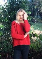 Red Merino Possum Jersey knitted on a larger needle, this is a looser knit
light as a feather. Crew neck, gently curving ribbed hem
and looser cuffs 