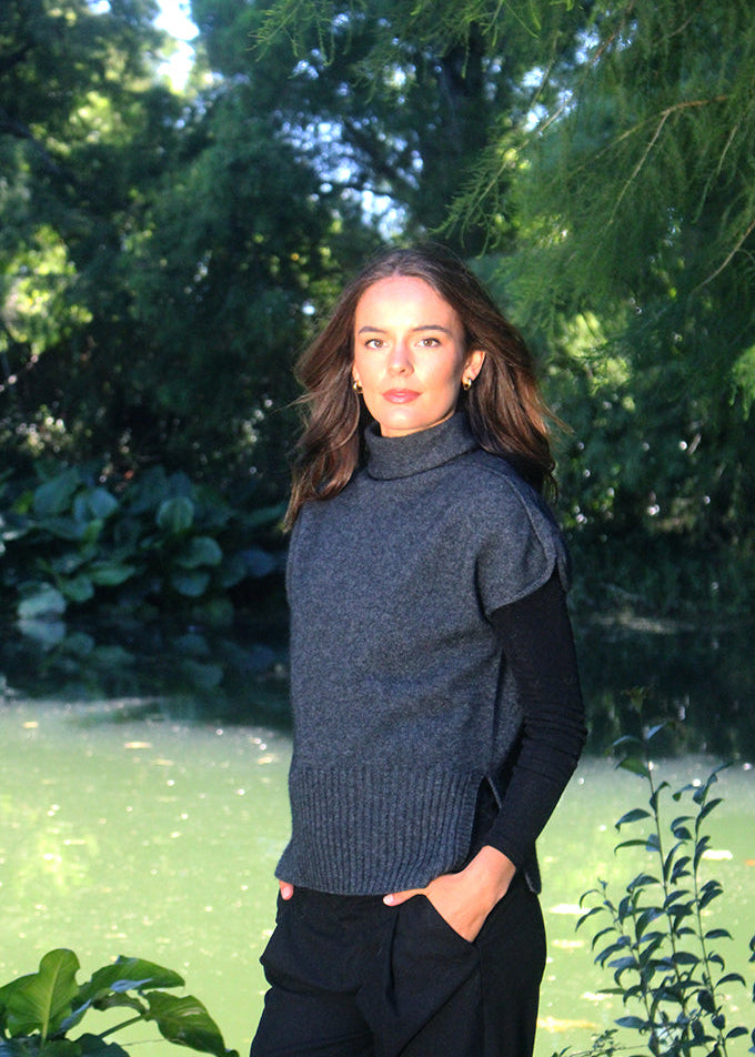 Charcoal Lothlorian entwine vest, with rib hem , rolled sleeve and turtle neck. A twist on the classic vest. 