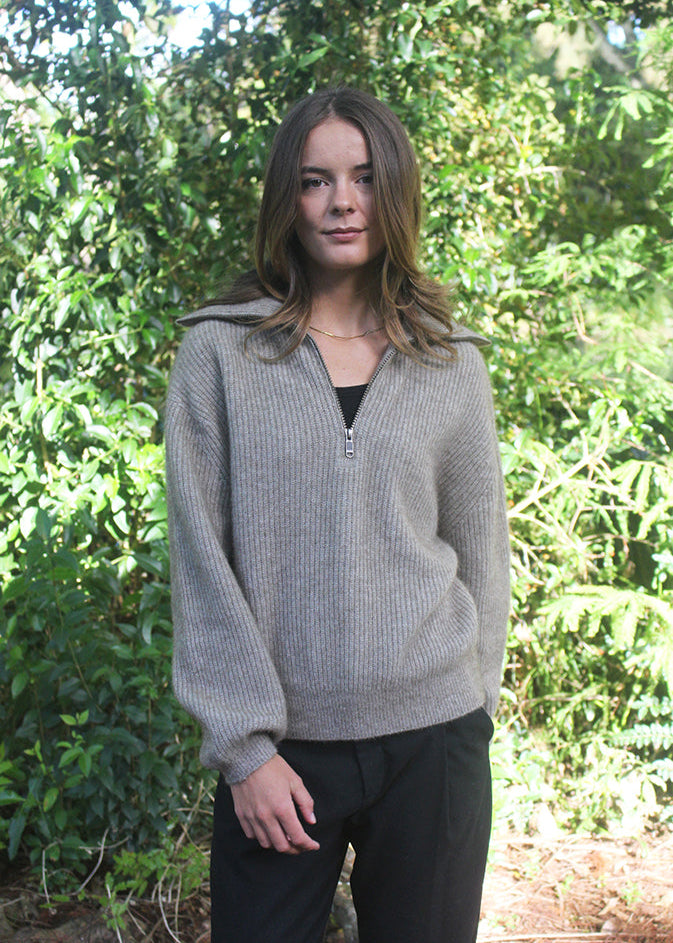 Natural woman's quarter-zip Merino Possum jersey with rib detail. 