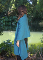 Teal Brando Poncho worn several ways super versatile.
