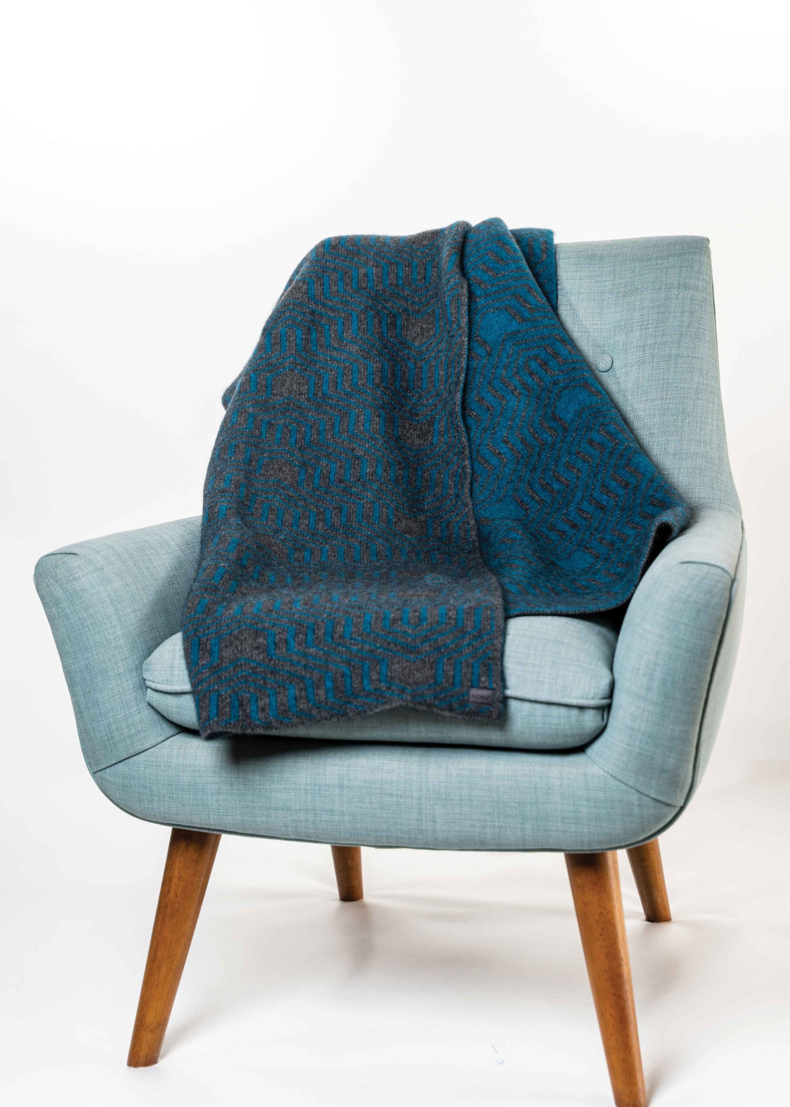 Koru Jacquard Throw

Possumsilk Collection™
A beautiful two-toned jacquard throw in a
multi-textured pattern.
This lovely, soft throw works well for both
home and travel.
YARN BLEND
65% Merino Wool
25% Possum Fur
10% Silk.
ONE SIZE—Approx. 130cm wide x 125cm long

KO965