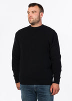 Man wearing a black jersey 100% Wool MKM 